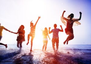 People jumping in the tide water.