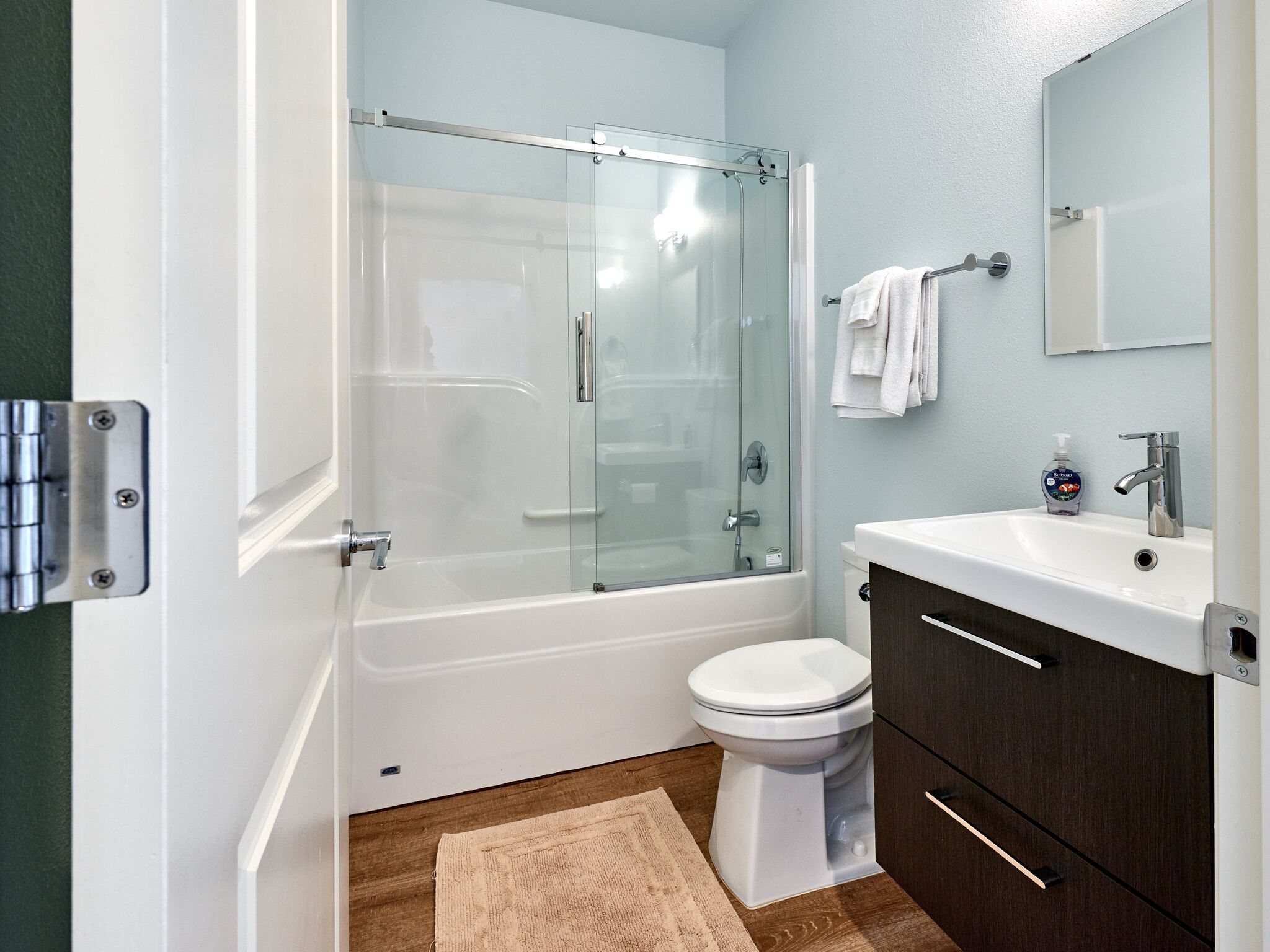 Vacation home bathroom with tub/shower combo.