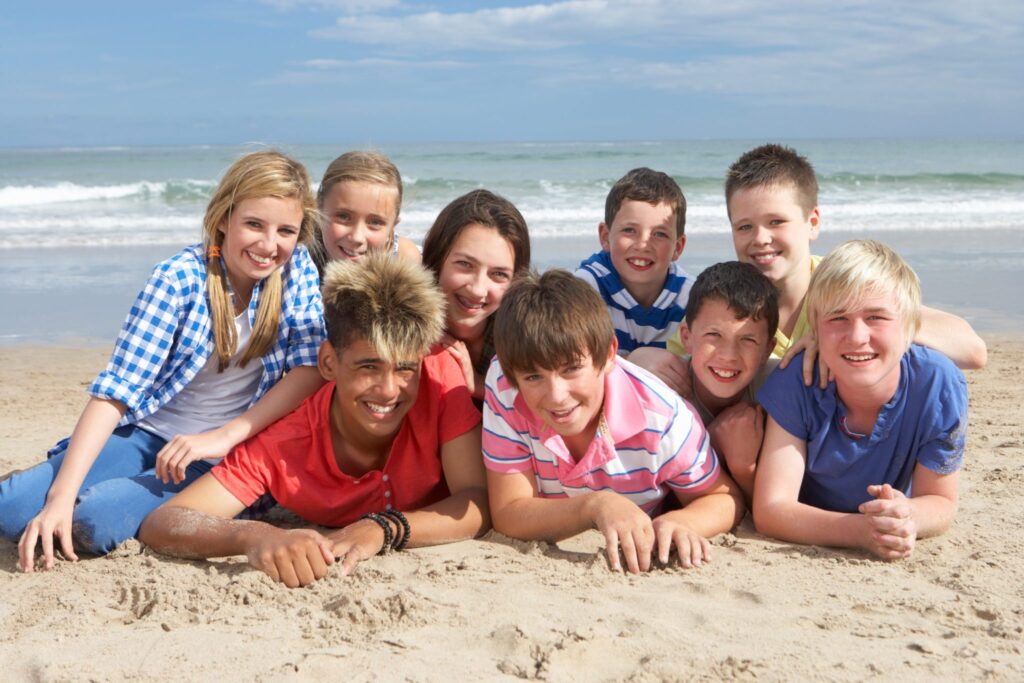 Young people posing on a beach. Young people posing on a beach.