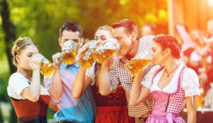 group at oktoberfest drinking beer.