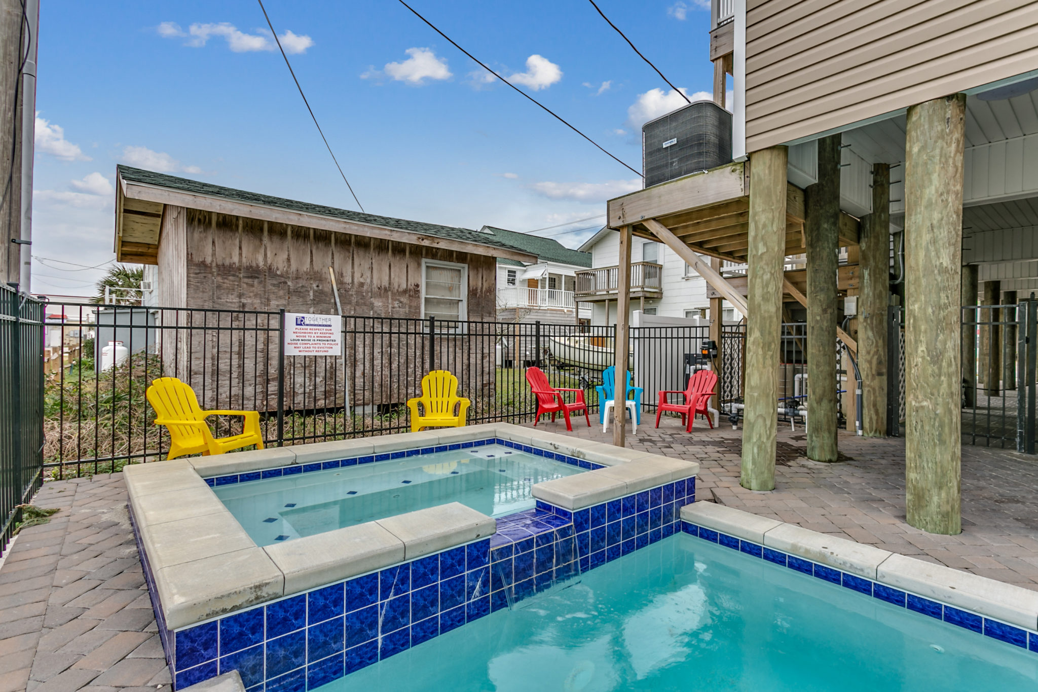2201 Spring Street outdoor pool, hot tub, patio, picnic table, gas grills, Adirondack chairs.