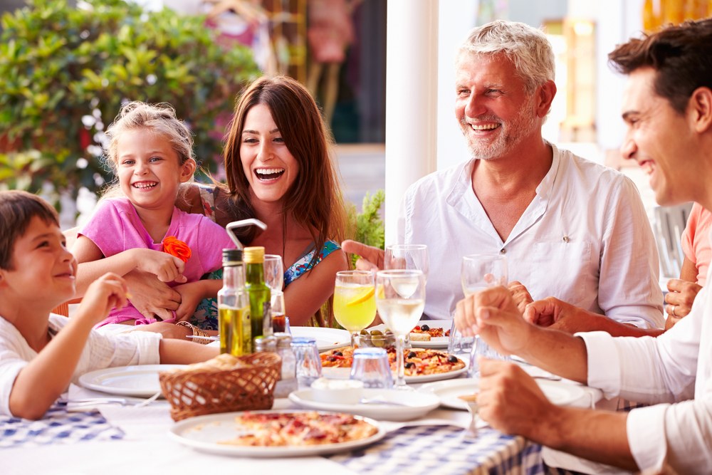 Family eating and laughing.