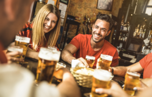 Group of friends with glasses of beer.