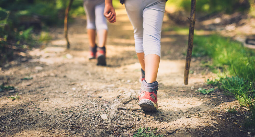 Photo of a pair of hikers traveling on a hiking trail near Cherry Grove, SC.